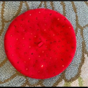 red beret adorned with sparkles